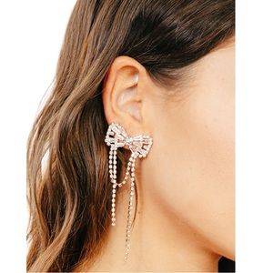 Rhinestone bow detail dangling earrings